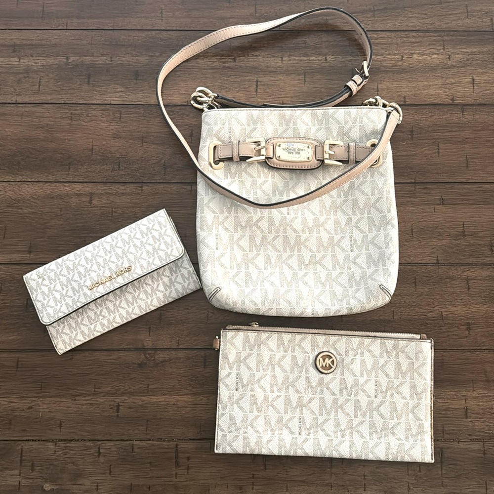 Crossbody bag in used condition with two matching wallets